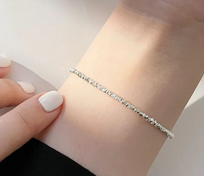 Close up of Freya Canadas I AM ASTERIA Sterling silver Starlight beaded bracelet on a feminine wrist