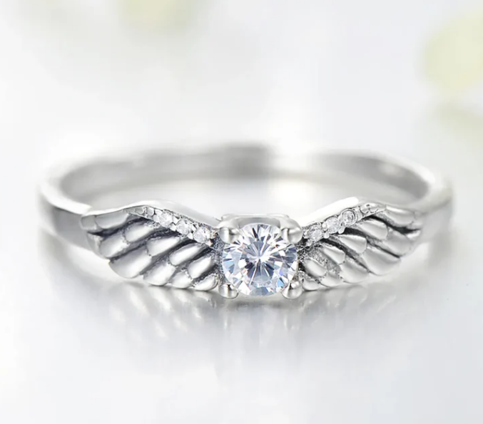Angel wings ring, angel wings solitaire ring, vintage angel wings ring, a vintage inspired diamond ring with angel wings in sterling silver.