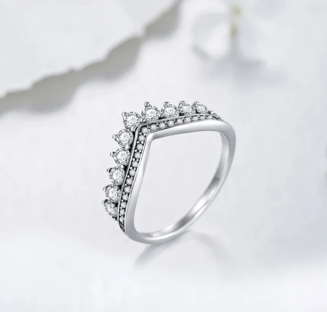 A ring fit for a queen or goddess, crown like design, diamond crusted, sterling silver band.