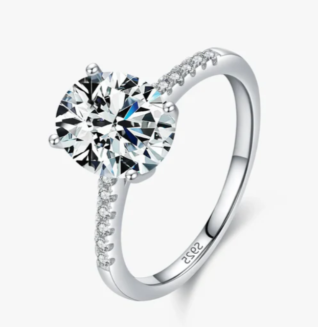 A studio shot of Freya Canadaās I AM SELENE Oval Solitaire Ring. This 2.5 carat sterling silver moissanite ring ships from Vancouver, BC.