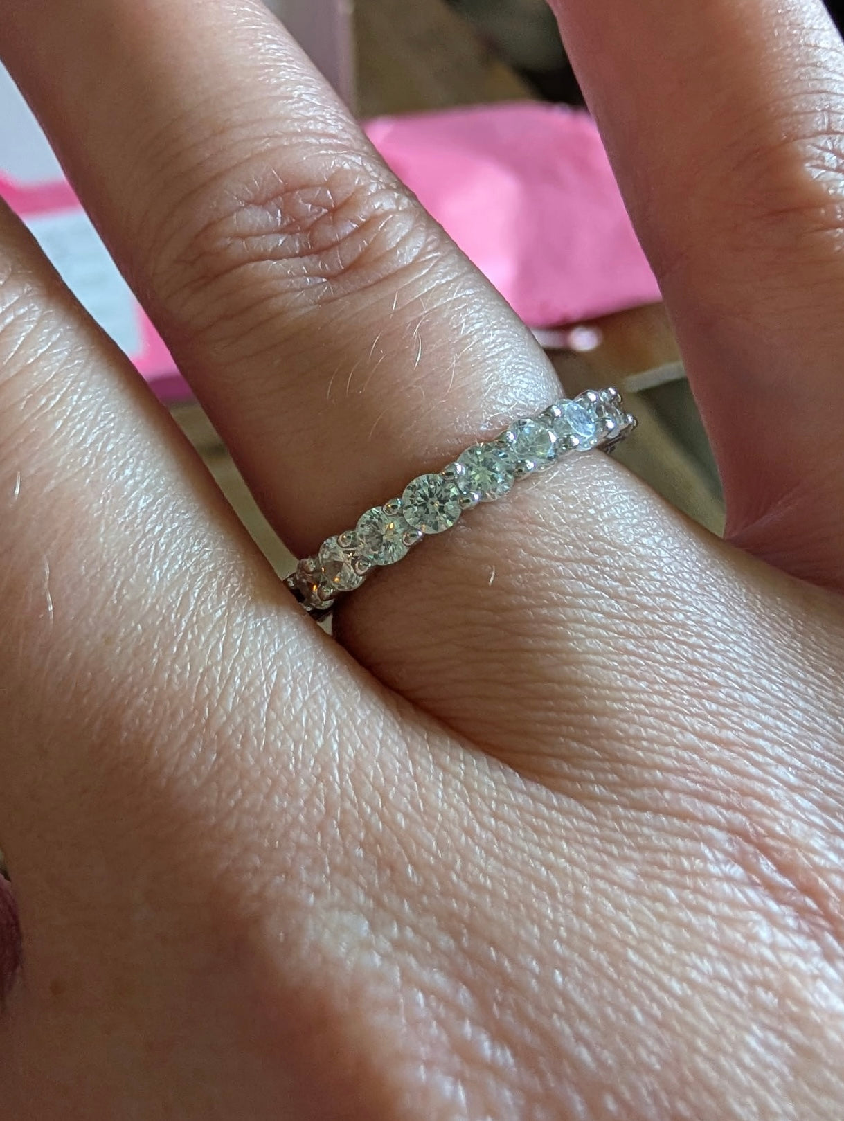Freya Canada’s I AM ETERNITY Radiant zircon band ring on Freya muse Kynna in natural lighting on ring finger