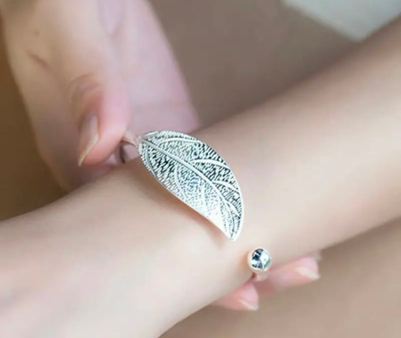 Model is wearing the I AM ARTEMIS Wild One Leaf Bangle from Freya Canada. Ships from Vancouver BC.