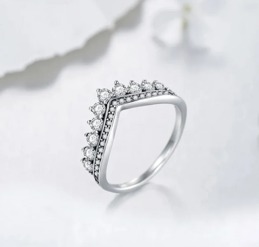 A ring fit for a queen or goddess, crown like design, diamond crusted, sterling silver band. 