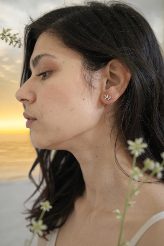 Model is wearing sterling silver I AM ATHENA Sacred Vine Earrings from Freya Canada. 925 sterling silver and ships from Vancouver BC. 