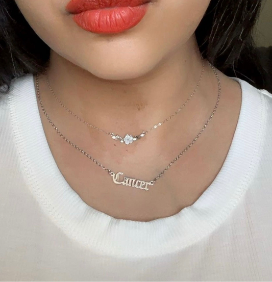 Model is wearing Freya Canada’s I AM FLORA Glass Petals Necklace. Also wearing Sigil & Smoke’s Cancer Nameplate Necklace. 