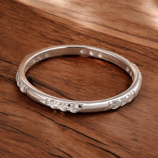 Freya Canada’s I AM ARTEMIS Delicate Pave Ring in sterling silver and zircon on a wooden table 