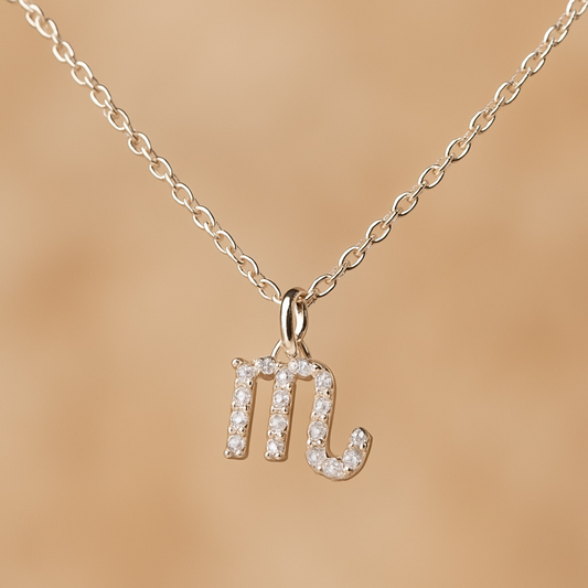 Freya Canada’s Scorpio Goddess Pave Charm Necklace on a beige background. Ships from Vancouver, B.C. 